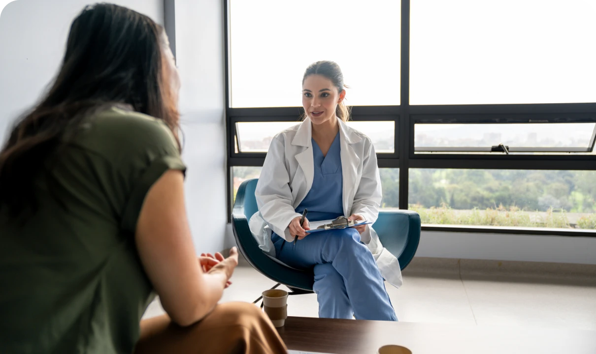 Medical professional talking to a woman